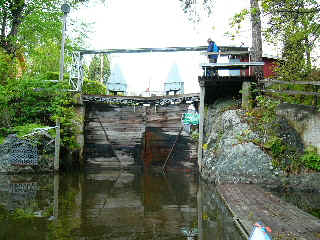 Lining canoe down over the lock gates.