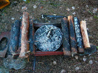 Dutch oven in the embers - yummy bread.